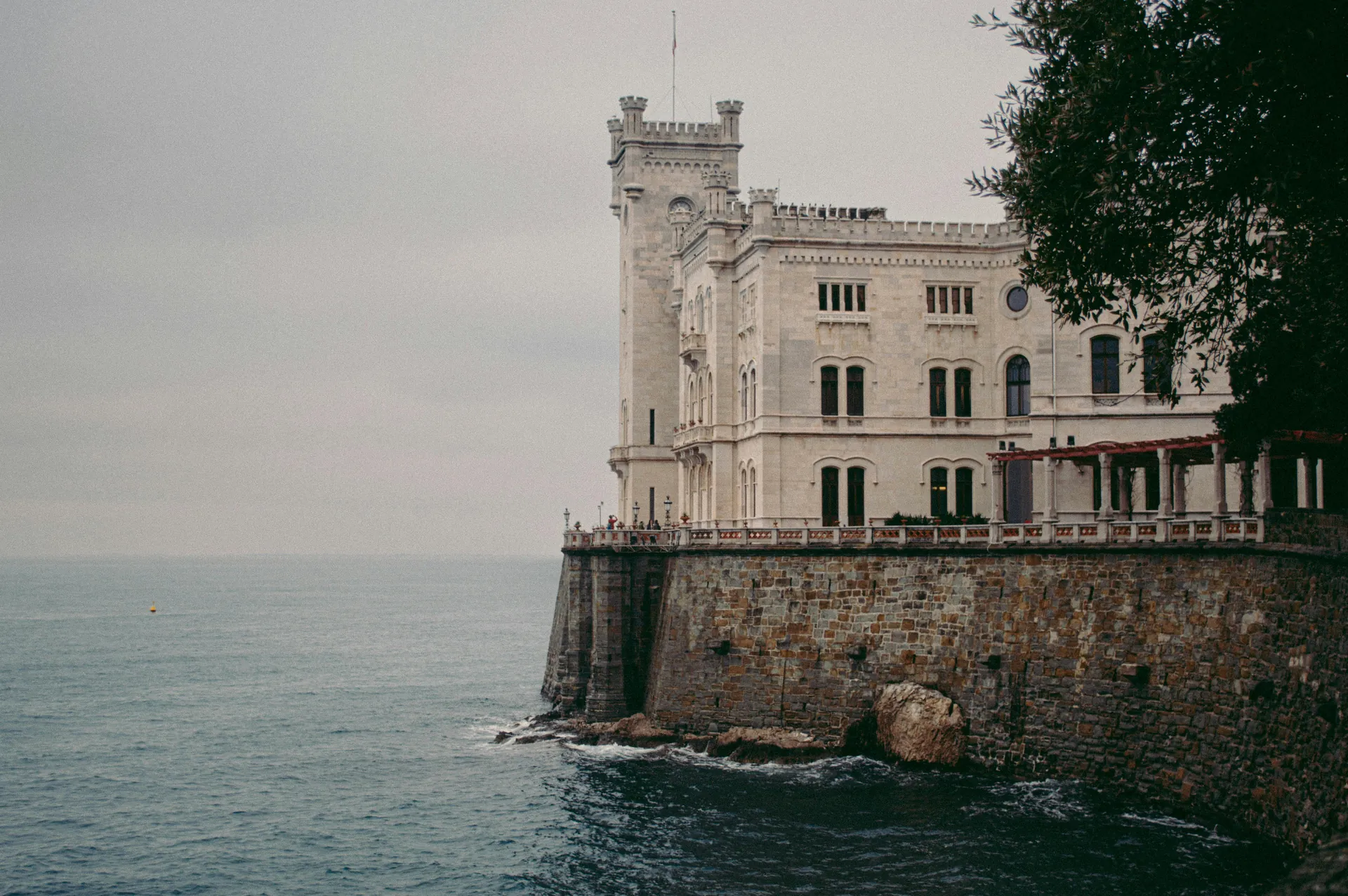 Miramare Castle overlooking the Adriatic Sea in Trieste, Italy, showcasing neoclassical architecture.